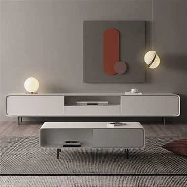 सफेद फर्श पर खड़ा टीवी कैबिनेट